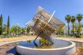 Huelva, Spain - April 28, 2022: Stainless steel cube monument in the gardens of the Campus de Ã¢â¬ÅEl CarmenÃ¢â¬Â of the Huelva